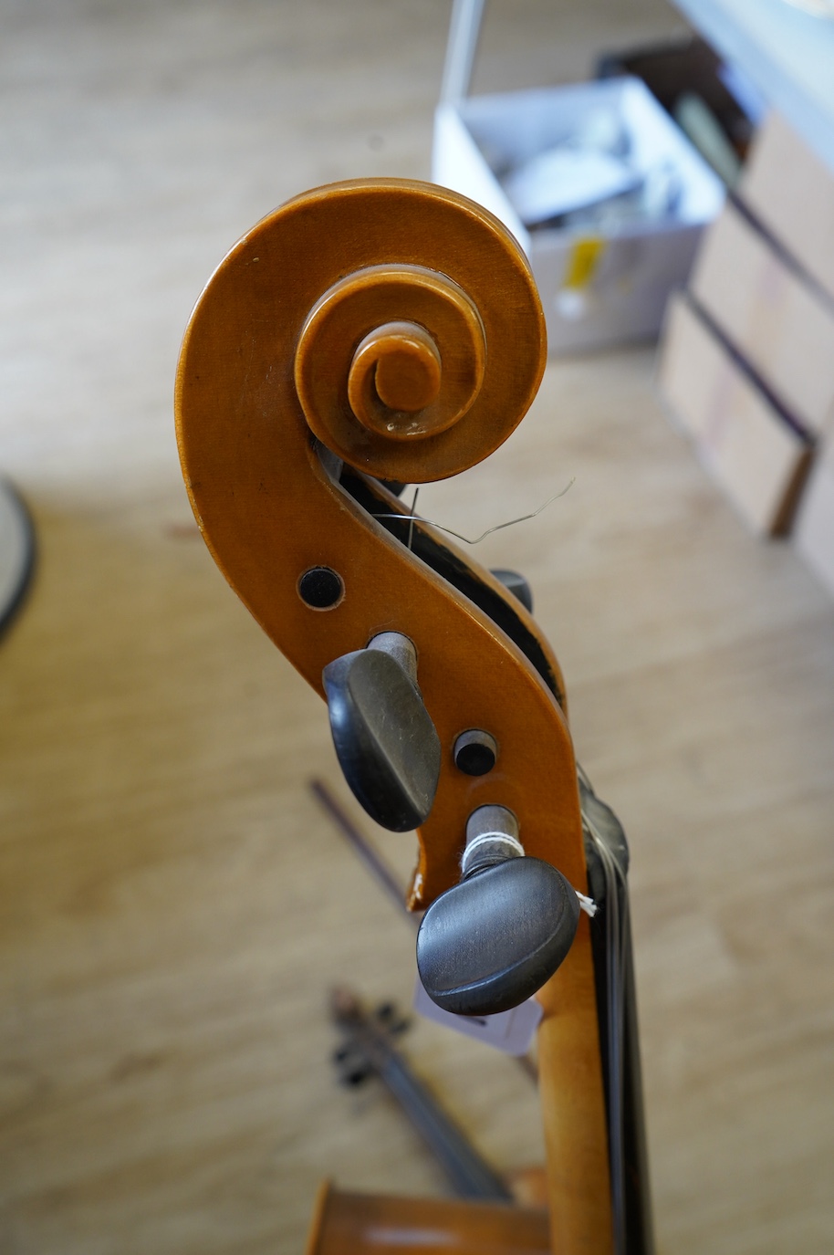 A student’s Golden Strad ‘cello imported by Boosey and Hawkes, body 69.5cm and violin, body 36cm, and a wooden conductors baton. Condition - poor to fair